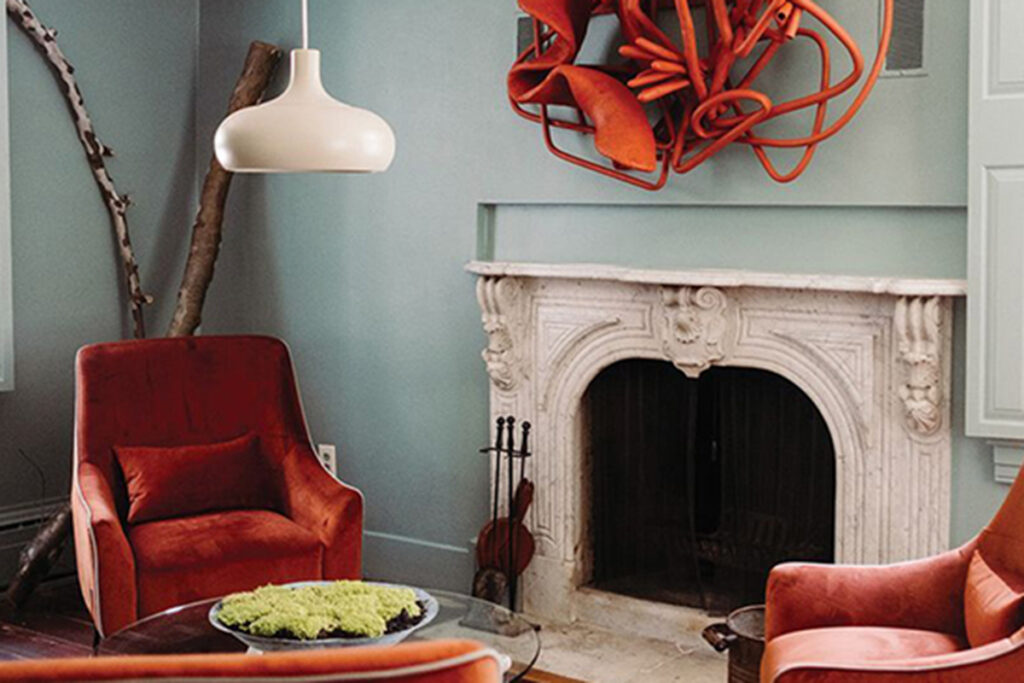 Hotel room with fireplace, chairs, and a coffee table