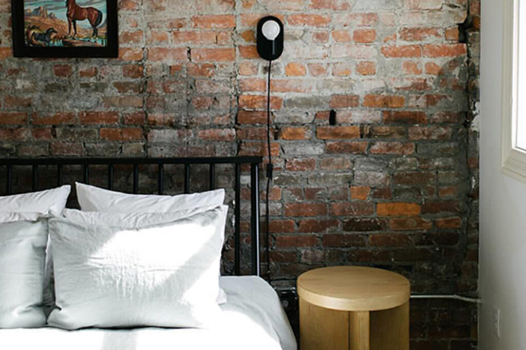 Hotel bedroom with bed and bedside table