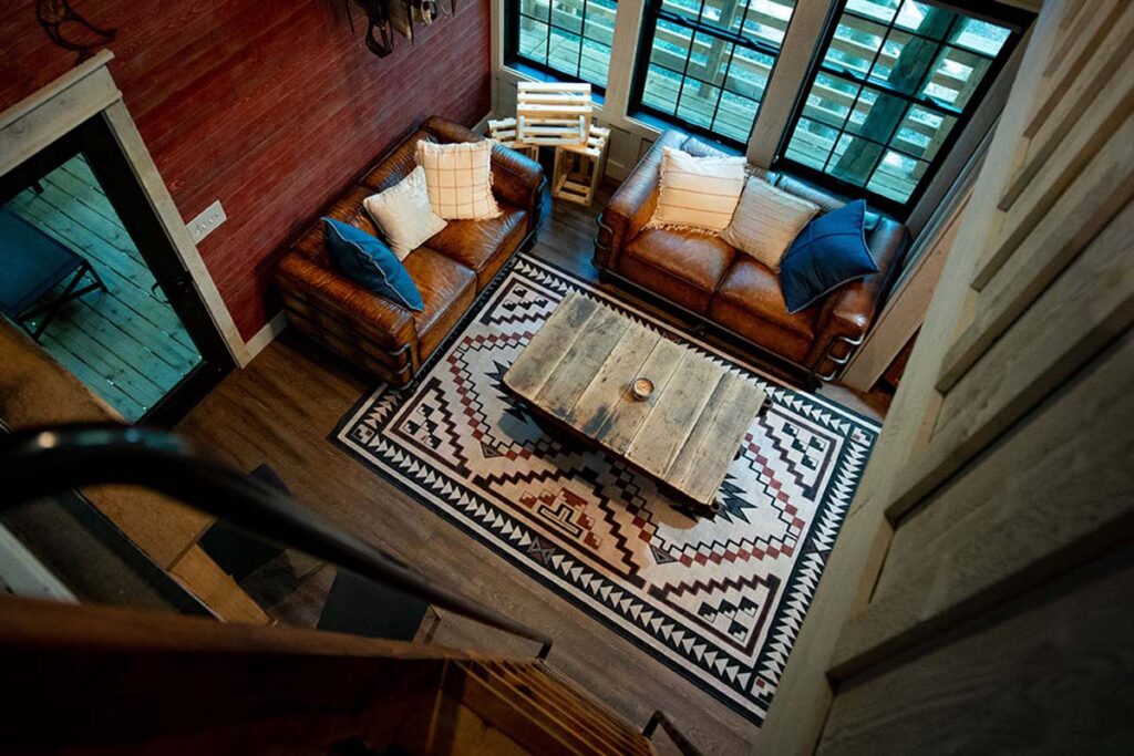 Cannaley Treehouse Village living room photographed from above. Couches and coffee table